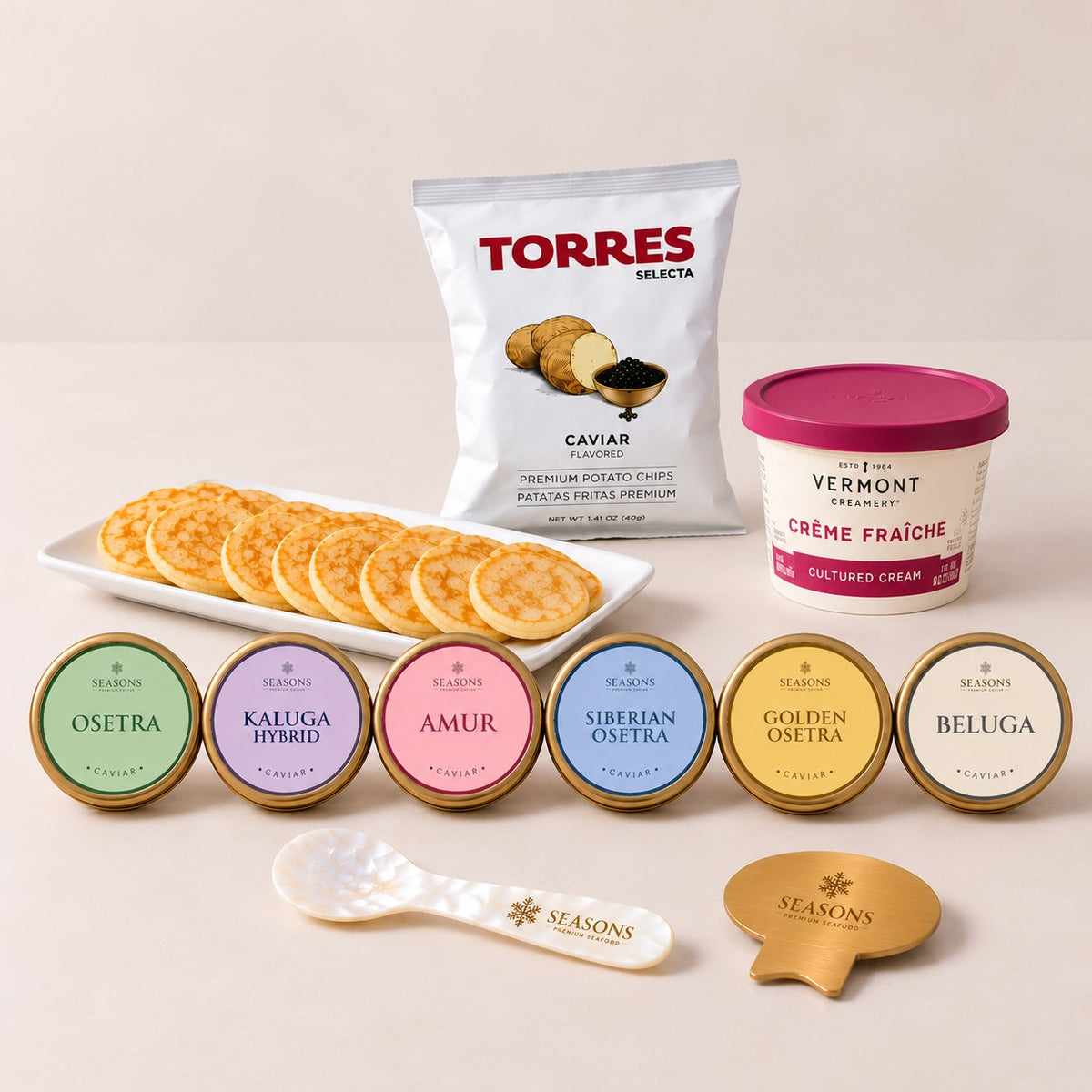 Full Collection Caviar Flight — all six SEASONS black caviars with chips, crème fraîche, spoon and caviar key